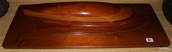 A laminated mahogany half-hull model